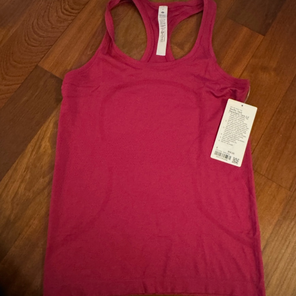 NWT Lululemon Swiftly Tech Racerback Tank Top 2.0
Hip Length, Raspberry color